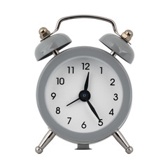 A gray clock with an alarm clock on a white background with arrows showing the time twelve hours twenty five minutes or twenty four hours twenty five minutes