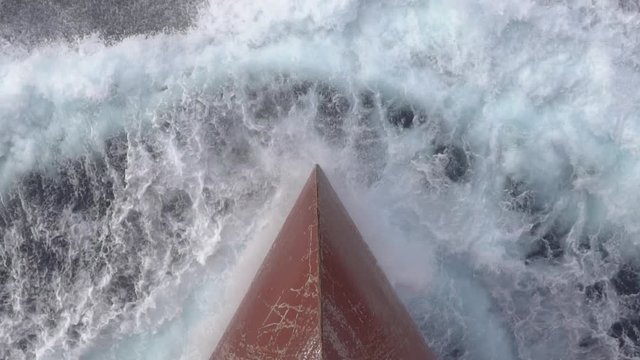 bow of the ship cuts the sea waves with spray and dive