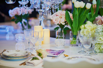 Beautiful table set with candles and flowers