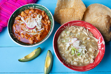 Mexican red and green pozole soup on blue background