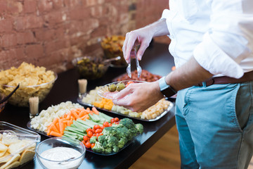 Man Going Through Buffet Line