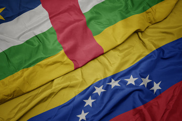 waving colorful flag of venezuela and national flag of central african republic.