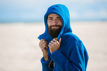 Man standing on a beach © suszczynski