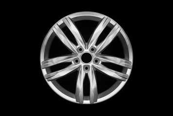 Obraz premium Modern car aluminium alloy wheel isolated on dark background