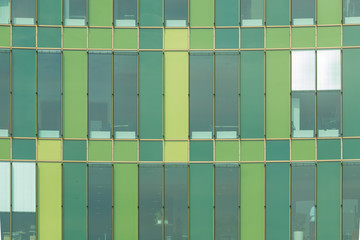 Cool green glass panels of a modern architecture.