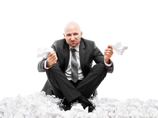Angry businessman in depression hand holding crumpled torn paper document