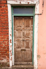 An old brown door in a building in Ireland