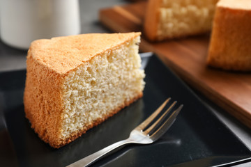 Fototapeta na wymiar Piece of delicious fresh homemade cake served on grey table