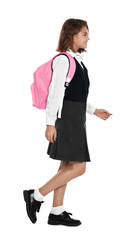 Happy girl in school uniform on white background