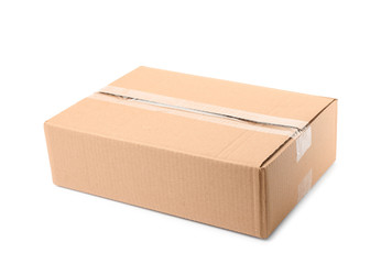 Closed cardboard box on white background. Mockup for design