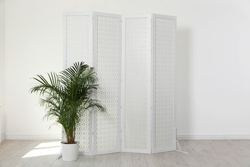 Modern folding screen in light spacious room