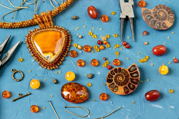 Amber cabochons, amonites, beads for making jewelry and amber necklaces.