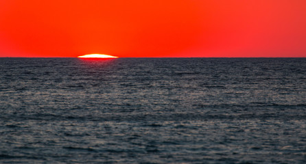 Fototapeta premium Ionian sea , red sunset, Salento, Italy
