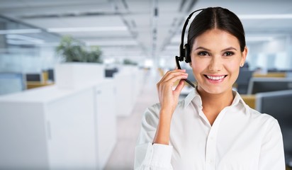 Young woman  with headphones, call center or support concept