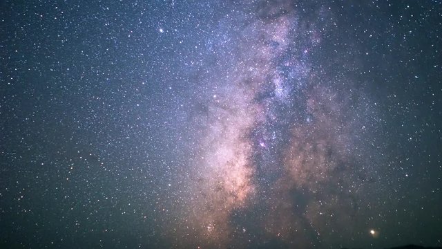 Timelapse of a beautiful and very colorful milky way with countless stars in the endless universe