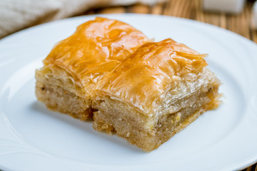 baklava with walnuts on wooden table. Turkish cuisine