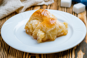 milk baklava on wooden table. Turkish cuisine