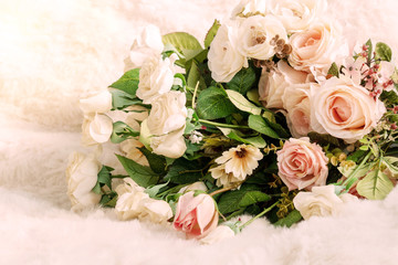 Bouquet flower on white cloth background. Decoration wedding blossom cloth flora on chair pink tone.