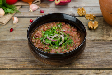 bean lobio in a pot on old wooden table