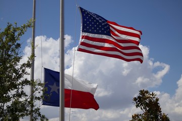 American and Texas Flags Flying At Half Mass