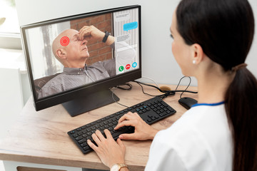 Doctor and senior woman patient, telehealth - obrazy, fototapety, plakaty