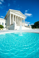 Bright scenic view of the Neoclassical columned entrance portico to the US Supreme Court building in Washington DC with a foreground fountain - obrazy, fototapety, plakaty