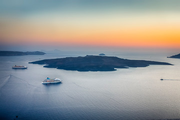 Line of Cruise Ships Offshore Thira on Santorini Island in Greece Before the Sunset