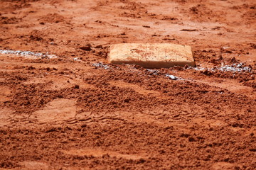 a baseball game base and clay