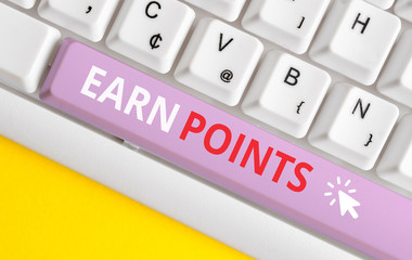 Writing note showing Earn Points. Business concept for getting praise or approval for something you have done White pc keyboard with note paper above the white background