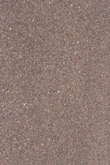 Background with brown fine sand of the sea coast