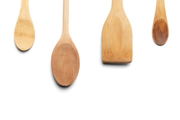 Wooden spoons and stirrer. Isolated on white background. Top view.