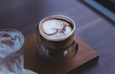 hot coffee on wooden table 