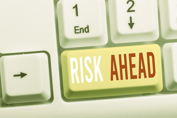 Writing note showing Risk Ahead. Business concept for A probability or threat of damage, injury,...