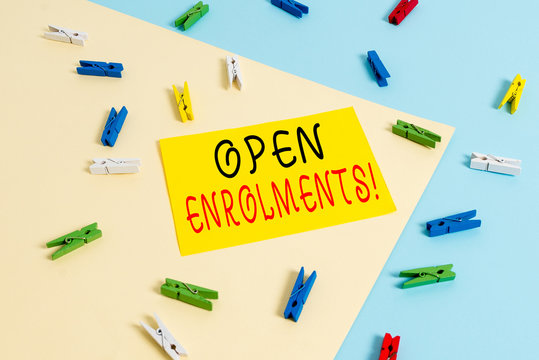 Text sign showing Open Enrolments. Business photo text when employees may make changes to elected fringe benefit Colored clothespin paper empty reminder yellow blue floor background office