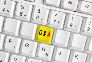 Writing note showing Q And A. Business concept for a period of time or an occasion when someone answers questions White pc keyboard with note paper above the white background