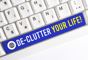 Writing note showing De Clutter Your Life. Business concept for remove unnecessary items from...