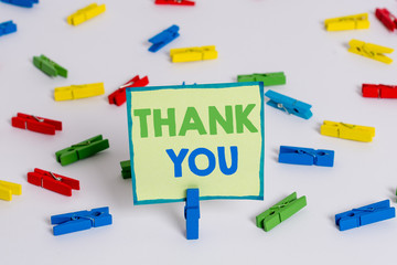 Conceptual hand writing showing Thank You. Concept meaning polite expression used when acknowledging gift service compliment Colored clothespin papers empty reminder white floor office