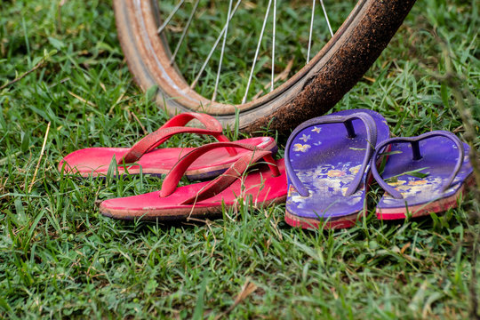 Two pairs used colorful sandal/ Slipper  with selective focus.