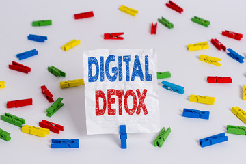 Text sign showing Digital Detox. Business photo showcasing Free of Electronic Devices Disconnect to Reconnect Unplugged Colored clothespin papers empty reminder white floor background office