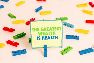 Conceptual hand writing showing The Greatest Wealth Is Health. Concept meaning Many sacrifice their money just to be healthy Colored clothespin papers empty reminder white floor office