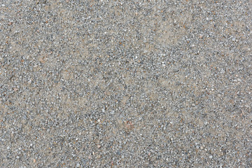 Closeup of damp grey concrete gravel background for building