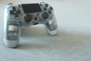 Gamepad or joypad controller for a video game console or pc. Wireless via bluetooth. You can see the rumble motors through the transparent plastic.