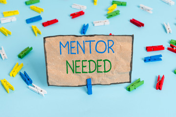 Handwriting text writing Mentor Needed. Conceptual photo wanted help for more experienced or more knowledgeable demonstrating Colored clothespin papers empty reminder blue floor background office pin
