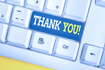 Word writing text Thank You. Business photo showcasing polite expression used when acknowledging gift service compliment White pc keyboard with empty note paper above white background key copy space