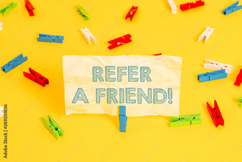 Aufkleber writing note showing refer a friend. business concept for direct someone to another or send him some