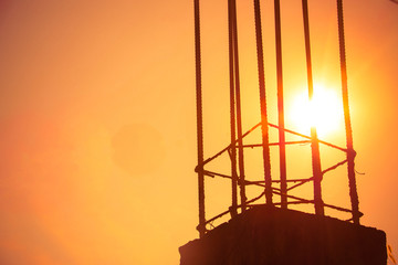 The silhouette of Steel structure against the sunset background,Steel structure on the construction site