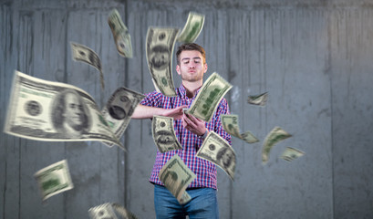 Obraz na płótnie Canvas businessman making the rain of money