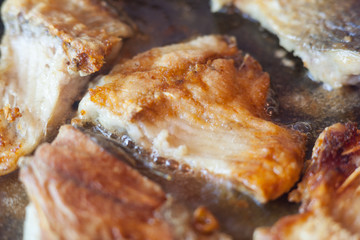 Fried fish in a pan. Fish fillet crucian, fried in a pan with sunflower oil for eating. Delicious...