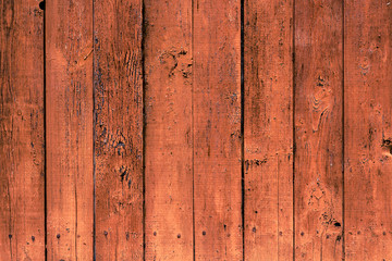 Obraz premium Background of old brown grunge fence. Vertical boards. Texture of dark wooden rustic panels.
