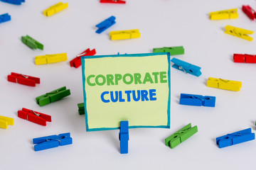 Conceptual hand writing showing Corporate Culture. Concept meaning pervasive values and attitudes that characterize a company Colored clothespin papers empty reminder white floor office